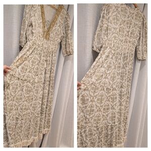 Cream and Metallic Gold Maxi Dress With Tassel Fringe Hem.